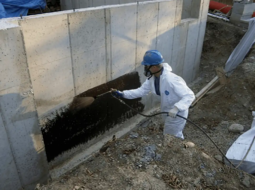 Professional waterproofing the exterior walls of the basement in Naperville, IL