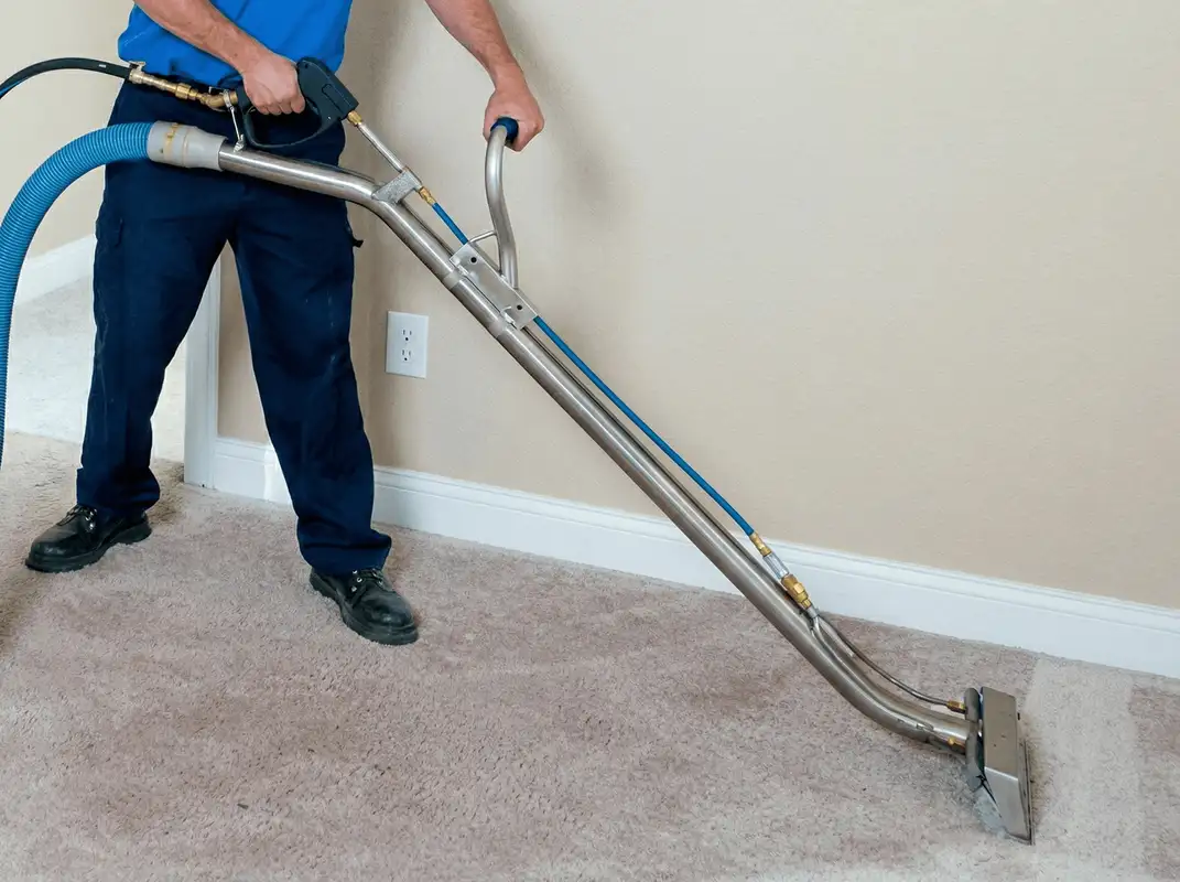 Professional operating a liquid removal machine on a carpeted floor in Naperville, IL